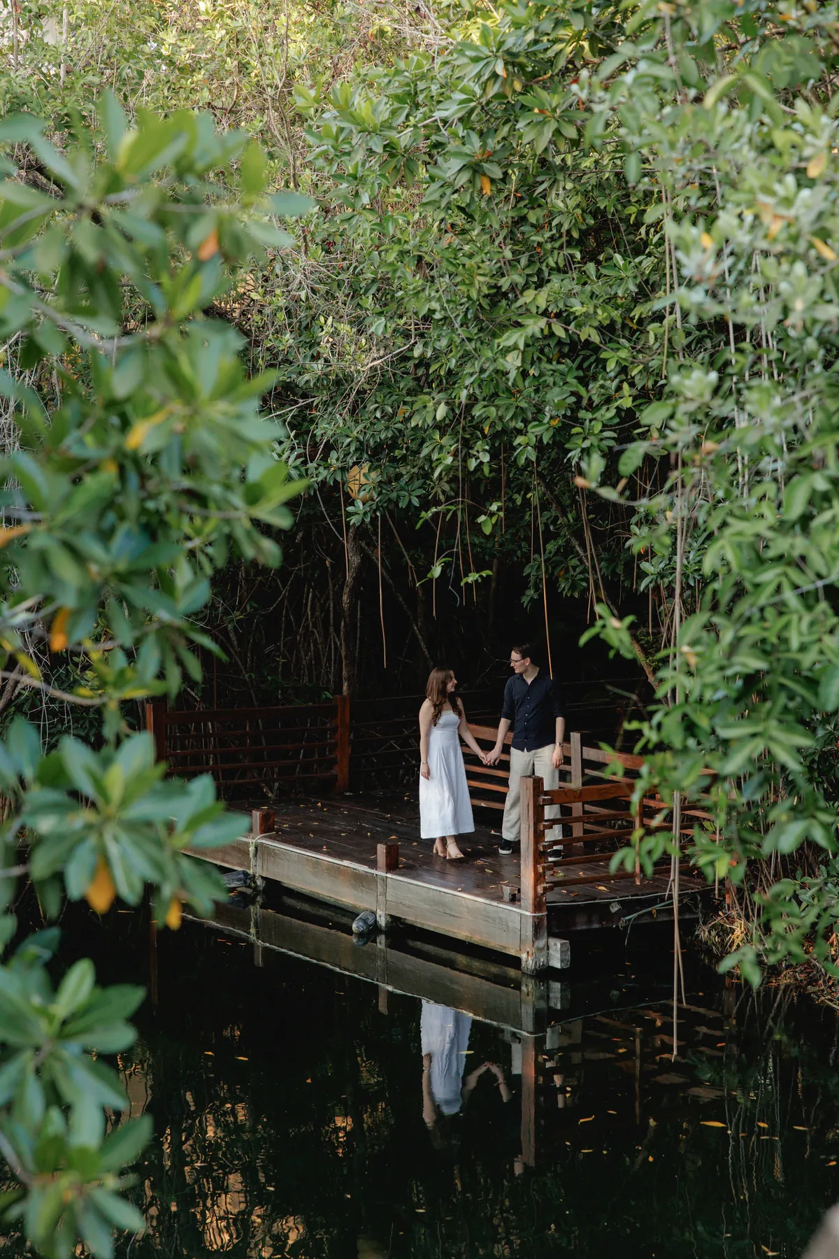 Ally and Marius on a dock among the mangroves